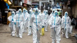 Healthcare workers arrive at a check-up camp in Malad, India on June 25, 2020. Manoej Paateel/Shutterstock